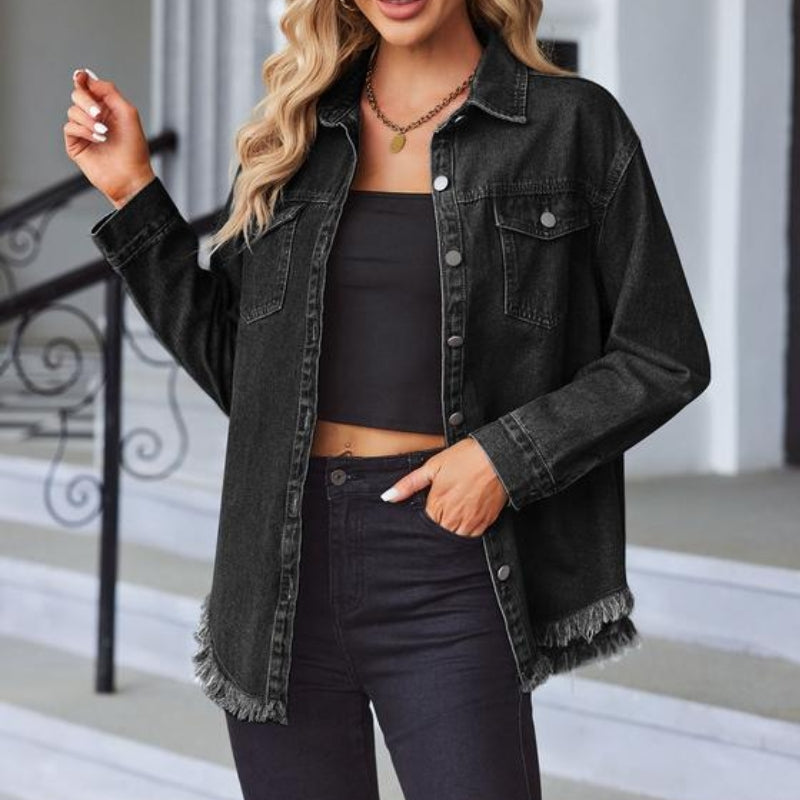 Women's oversized blue denim jacket with raw fringe detailing and snap front closure