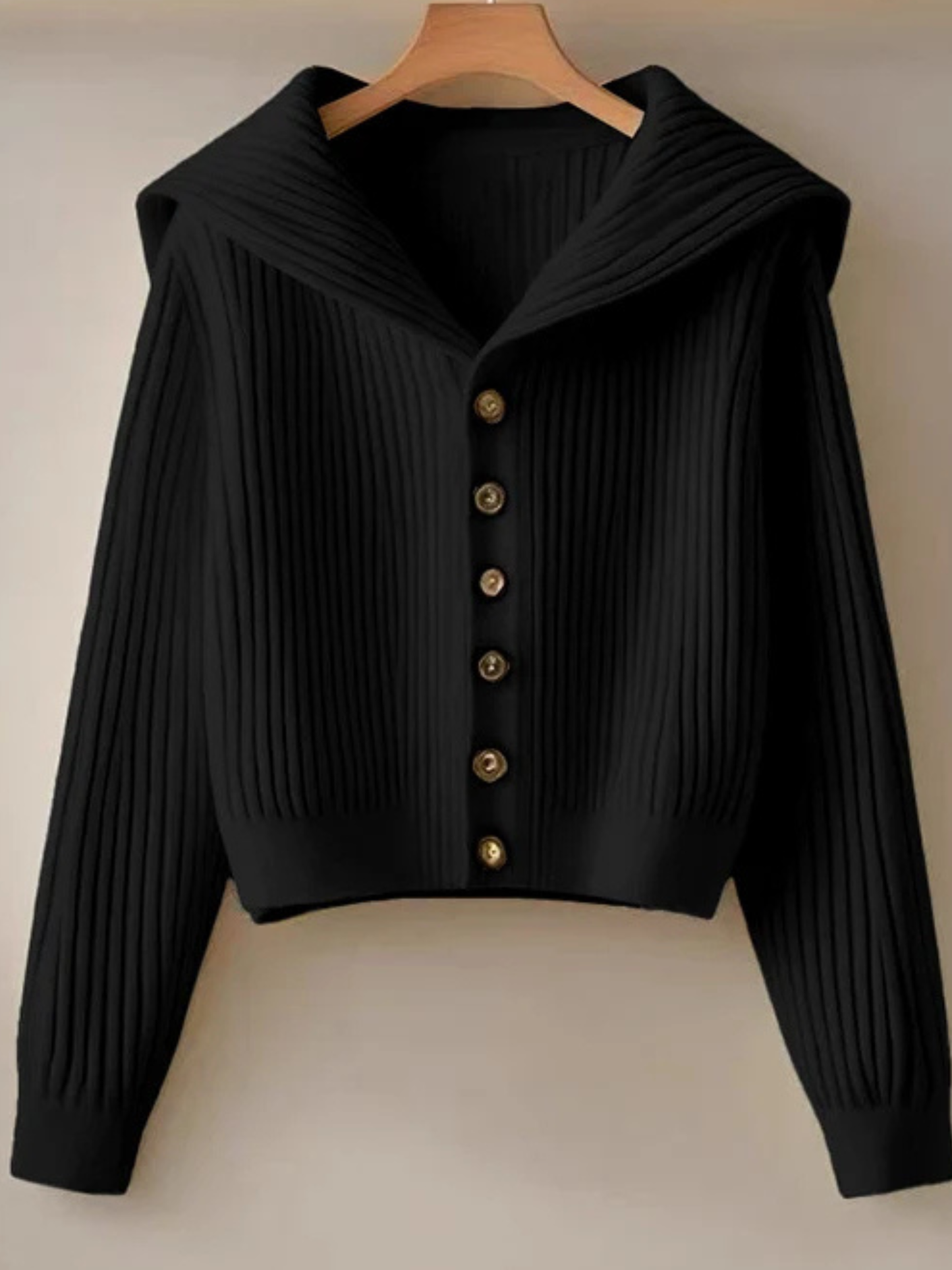 Cropped rib knit cardigan with dramatic oversized sailor collar in modern minimalist style