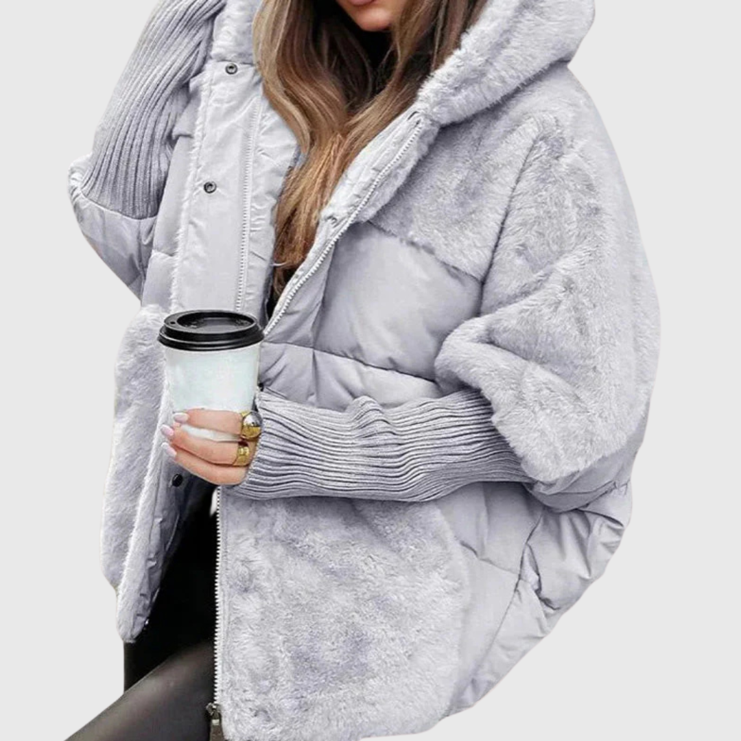 Women's oversized faux fur puffer jacket with hood, quilted panels and contrast ribbed sleeves