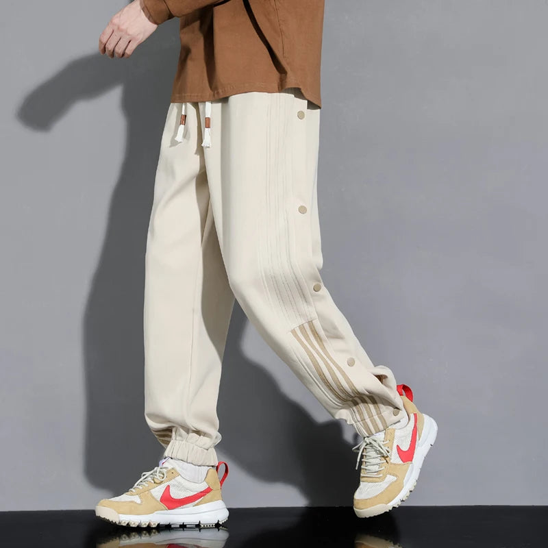 Ethos snap-track joggers in neutral tones, relaxed streetwear fit with snap-on side closures