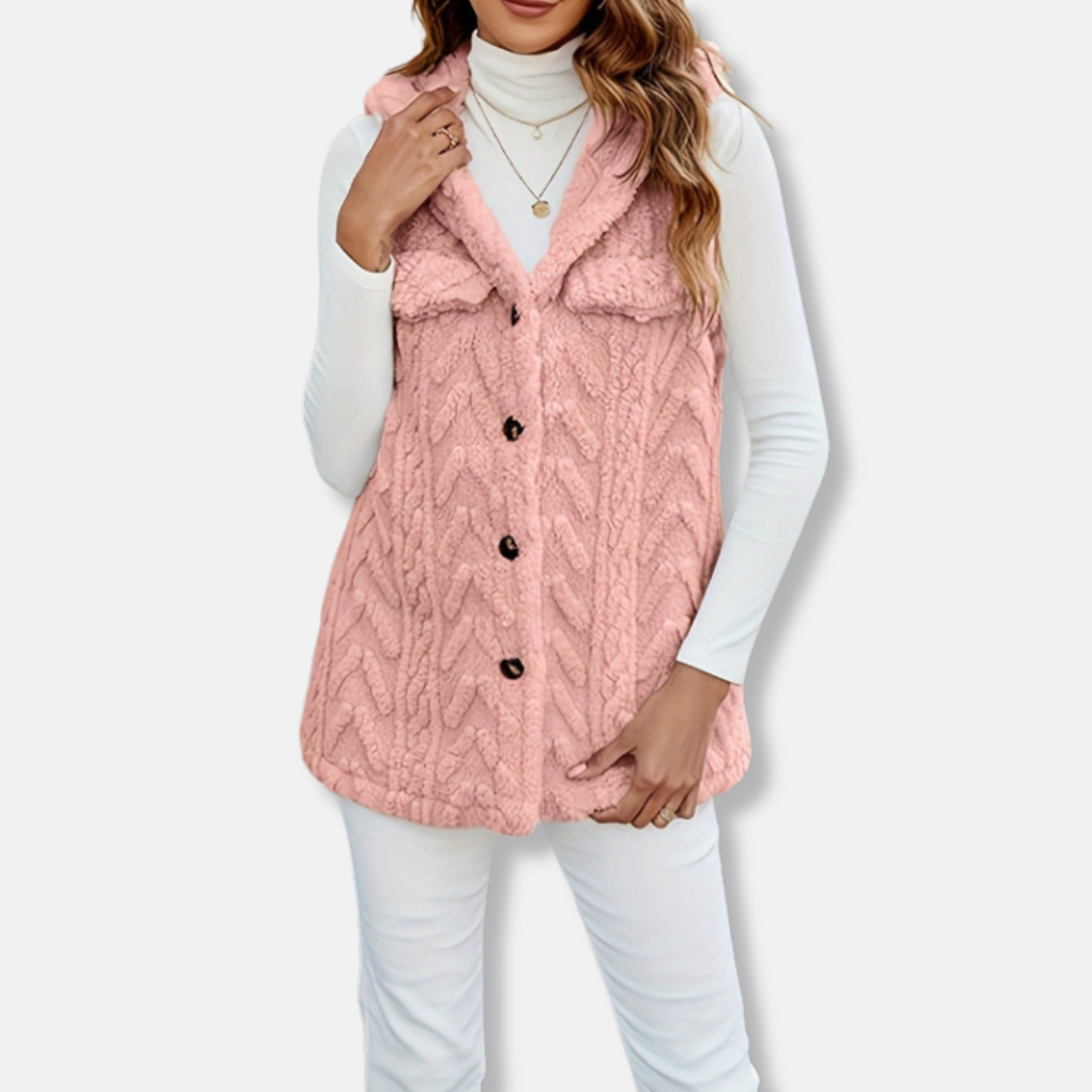 Women's cable knit hooded vest in cozy fuzzy texture with relaxed fit and functional pockets