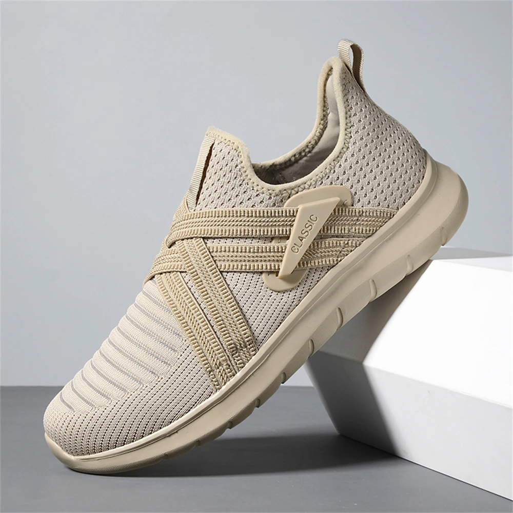 Gray slip-on walking sneakers with shock-absorbing sole, wide toe box, and padded heel collar