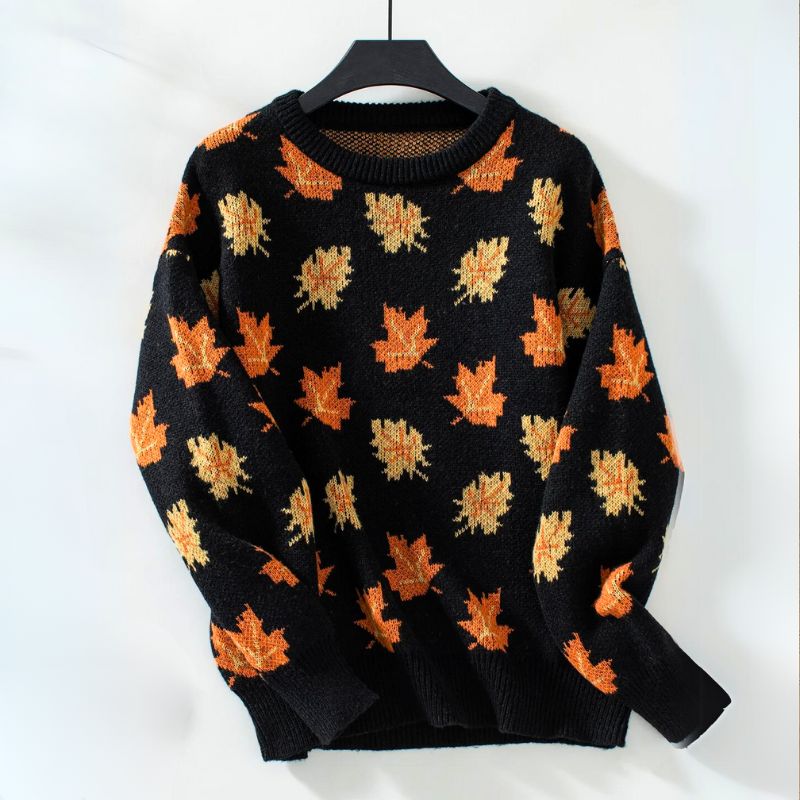 Women's autumn leaf print cozy knit sweater in warm fall tones with soft relaxed fit