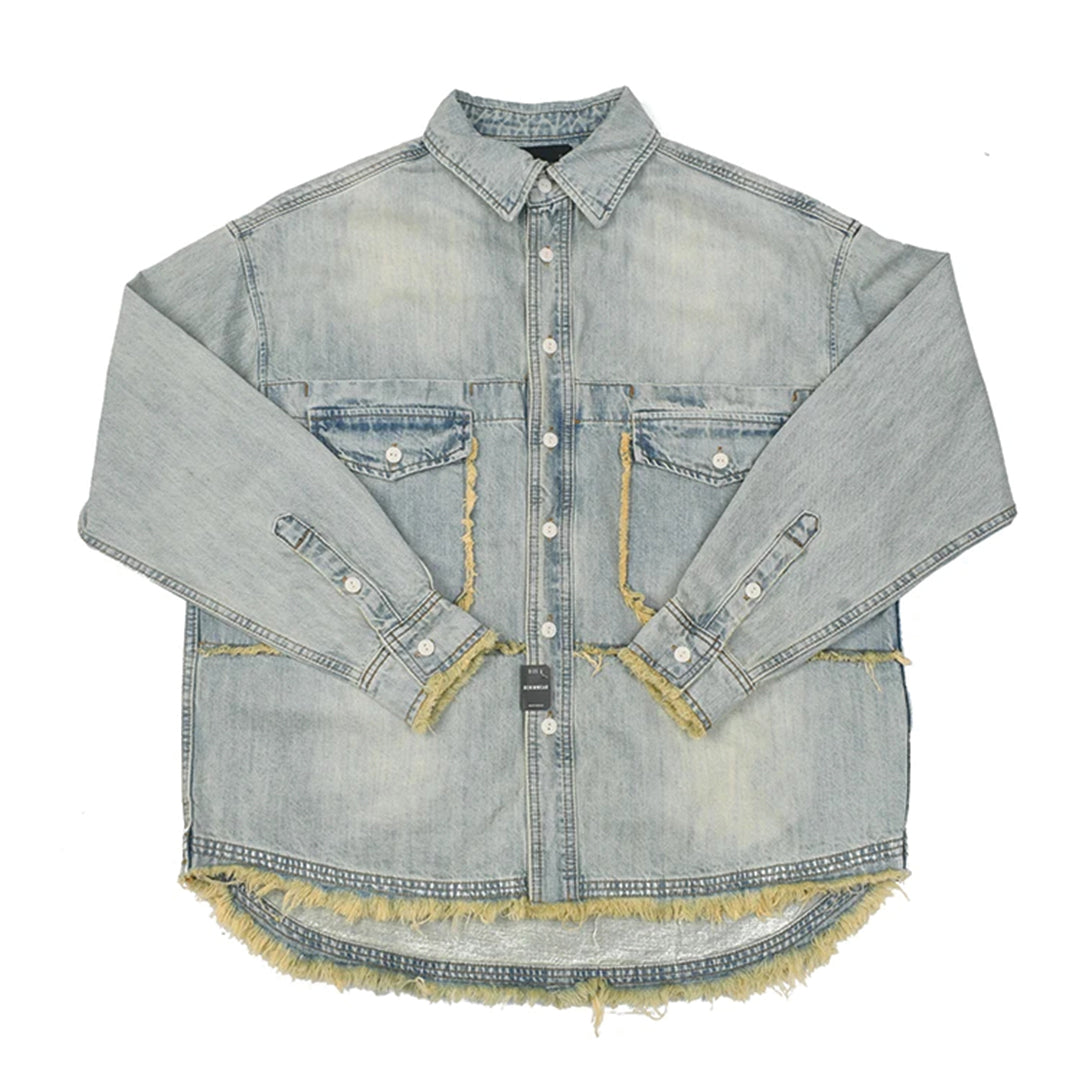 Loose blue washed cotton denim shirt with frayed hem and tassel trims workwear style