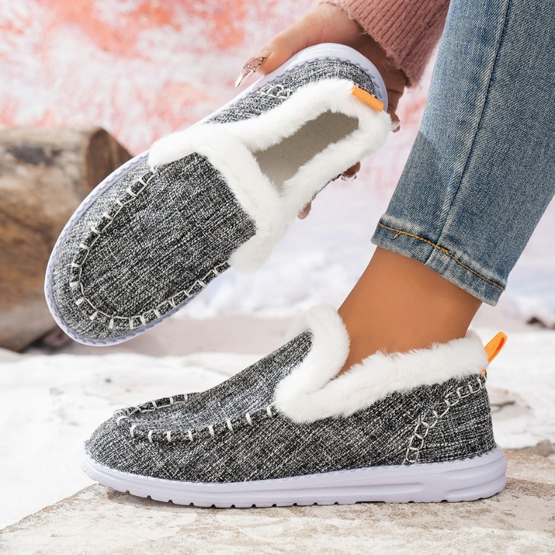 Suede slip-on loafers with warm fur lining and snow-grip outsole for winter days