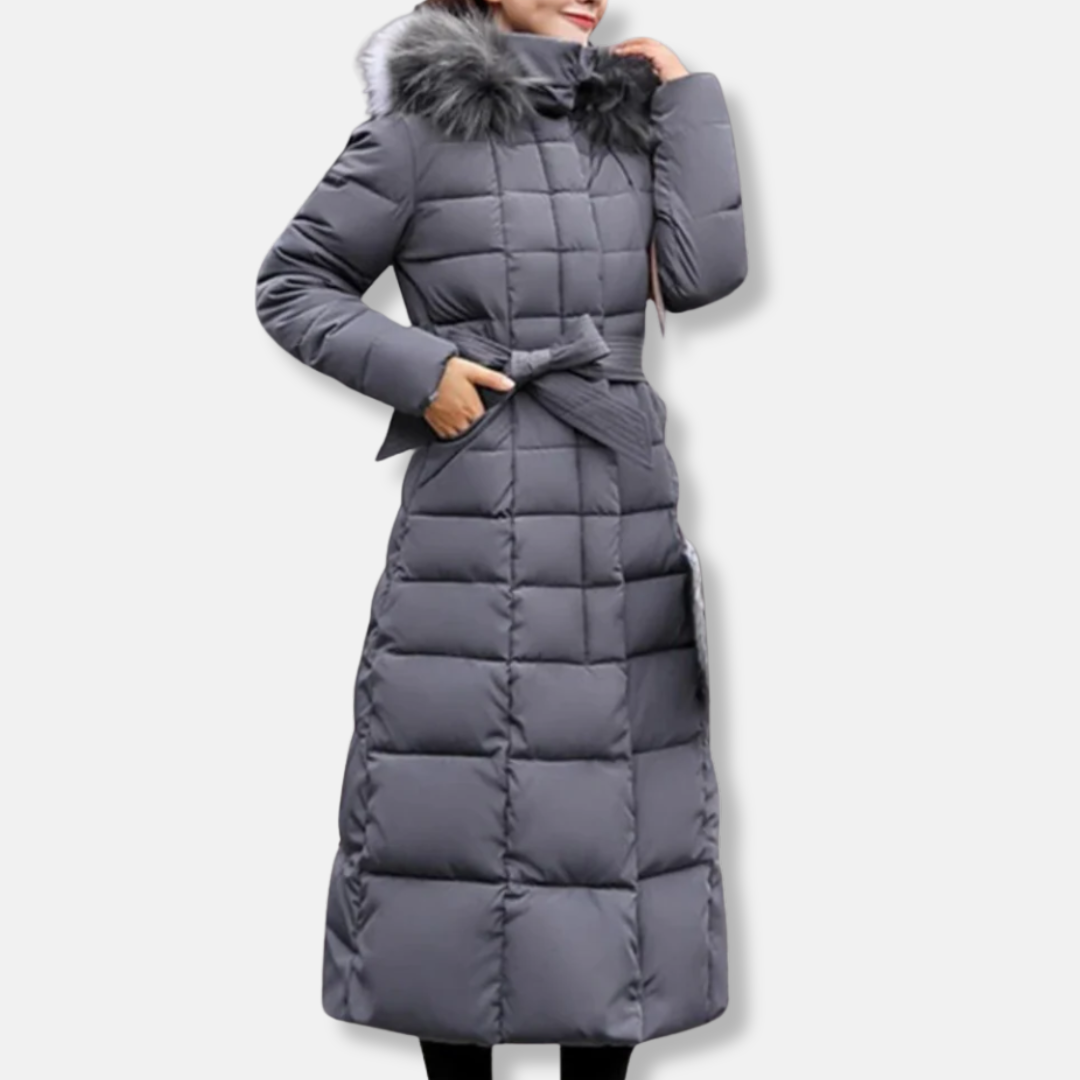 Women's long quilted slim-fit coat with belted waist and faux fur hood for cold weather