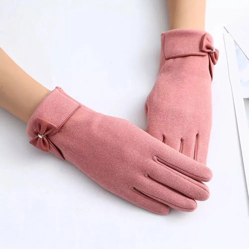 Women's black winter gloves with elegant bow detail and touchscreen-compatible split finger design