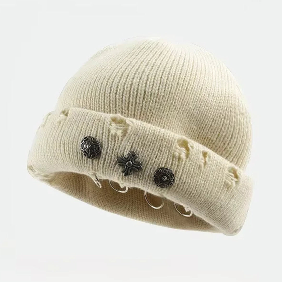Distressed black knit beanie with cross piercing hardware and streetwear-ready ribbed cuff