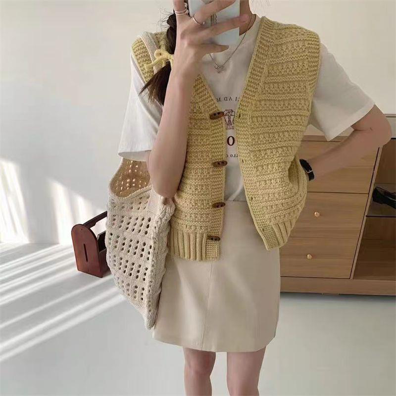 Women's sleeveless knit cardigan in soft wool, timeless chic silhouette with clean armhole design