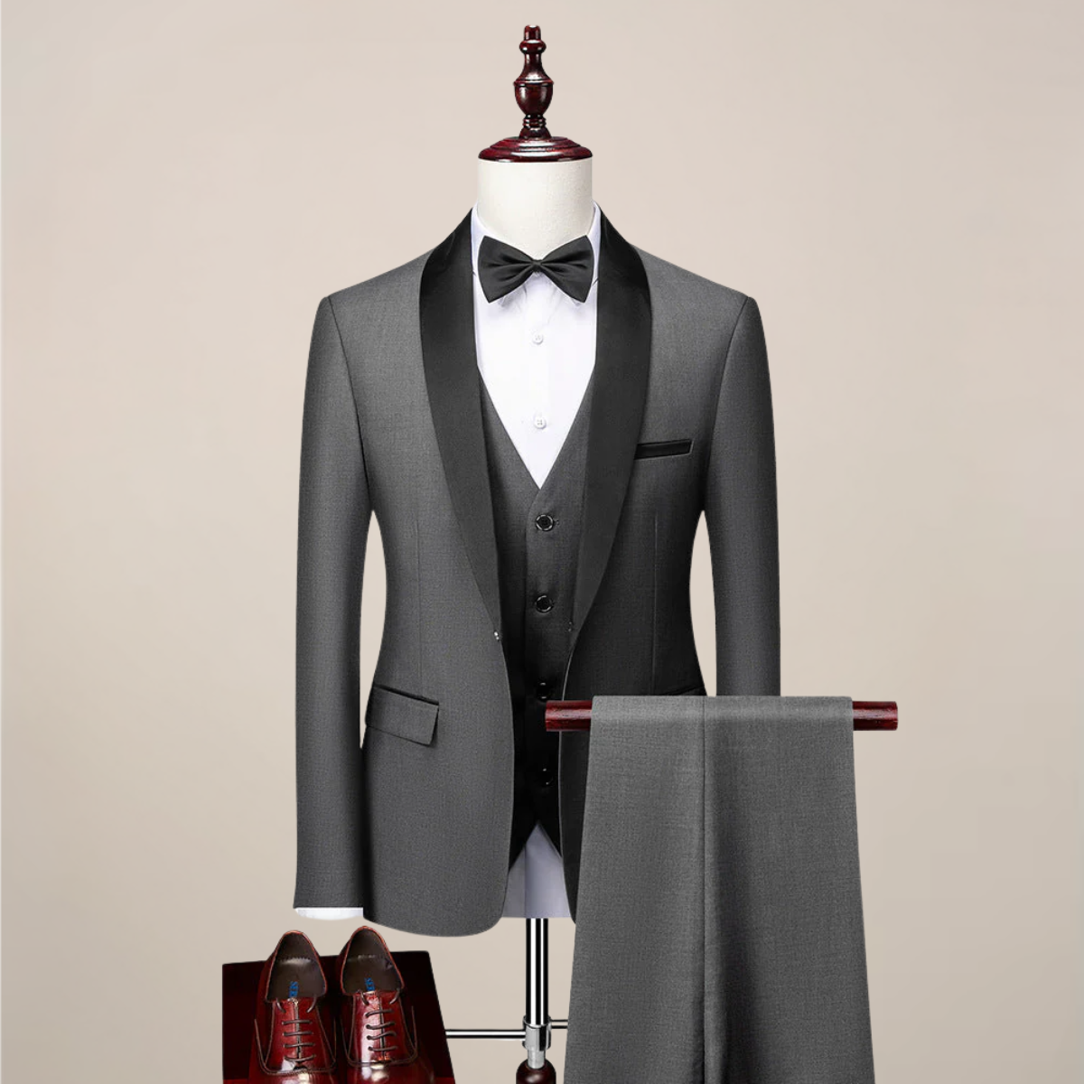 Men's slim fit black three-piece dinner suit with contrast shawl lapels, waistcoat, and tapered trousers