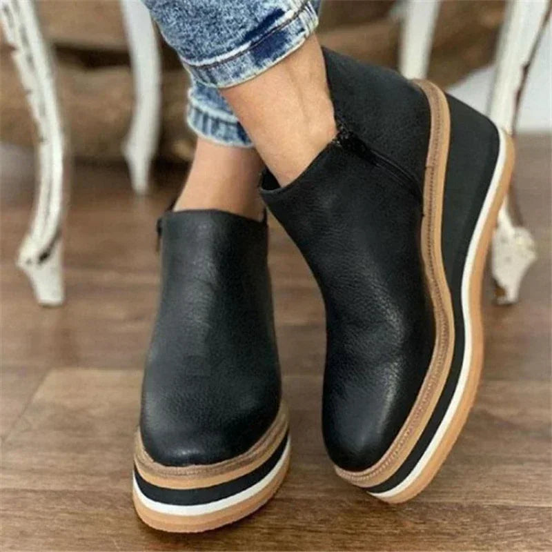 Women's black platform wedge ankle boots with cushioned sole, stylish everyday lift and all-day support