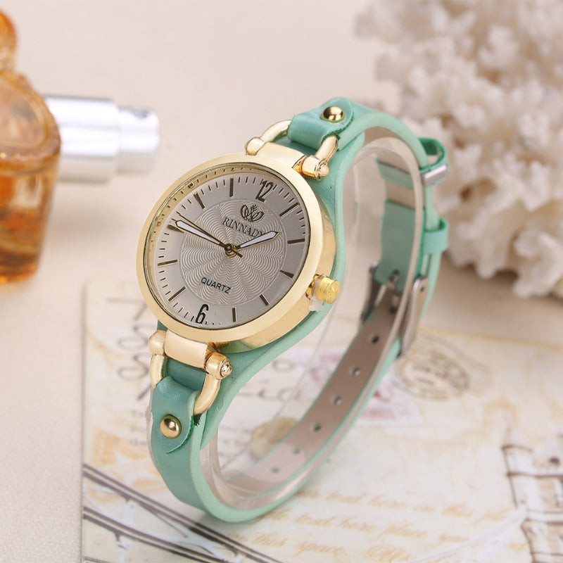 Slim quartz watch engraved silver dial polished bezel brown leather strap refined professional style