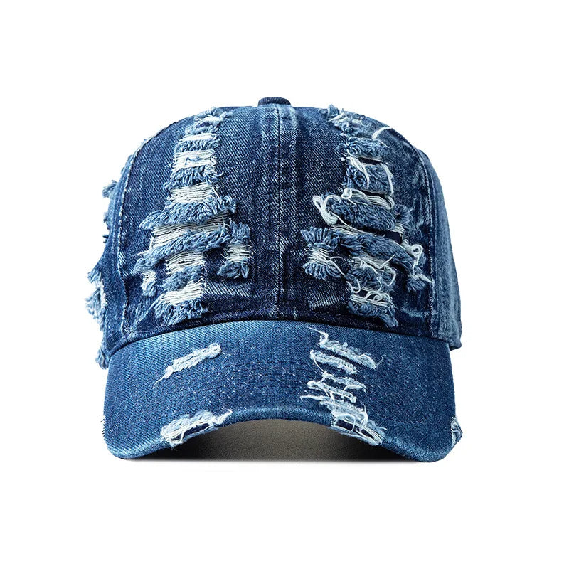 Sun-faded distressed denim cap with shredded texture and adjustable fit for bold streetwear style