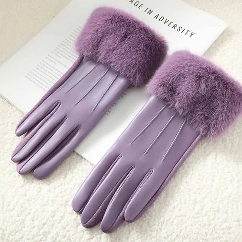 Women's black faux leather gloves with fluffy faux fur cuffs and touchscreen-compatible fingertips