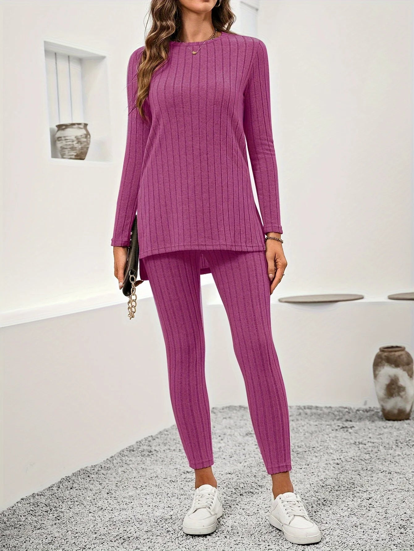 Women's ribbed knit lounge set in neutral tones, tunic top and leggings, soft warm two-piece silhouette