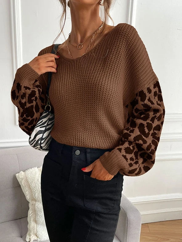 Women's beige waffle knit drape sweater with bold leopard jacquard sleeves, relaxed fit