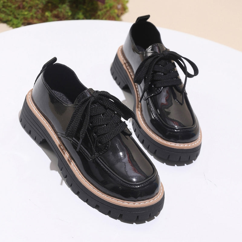 White leather platform loafers with rugged deep lug sole, bold chunky base for urban street style