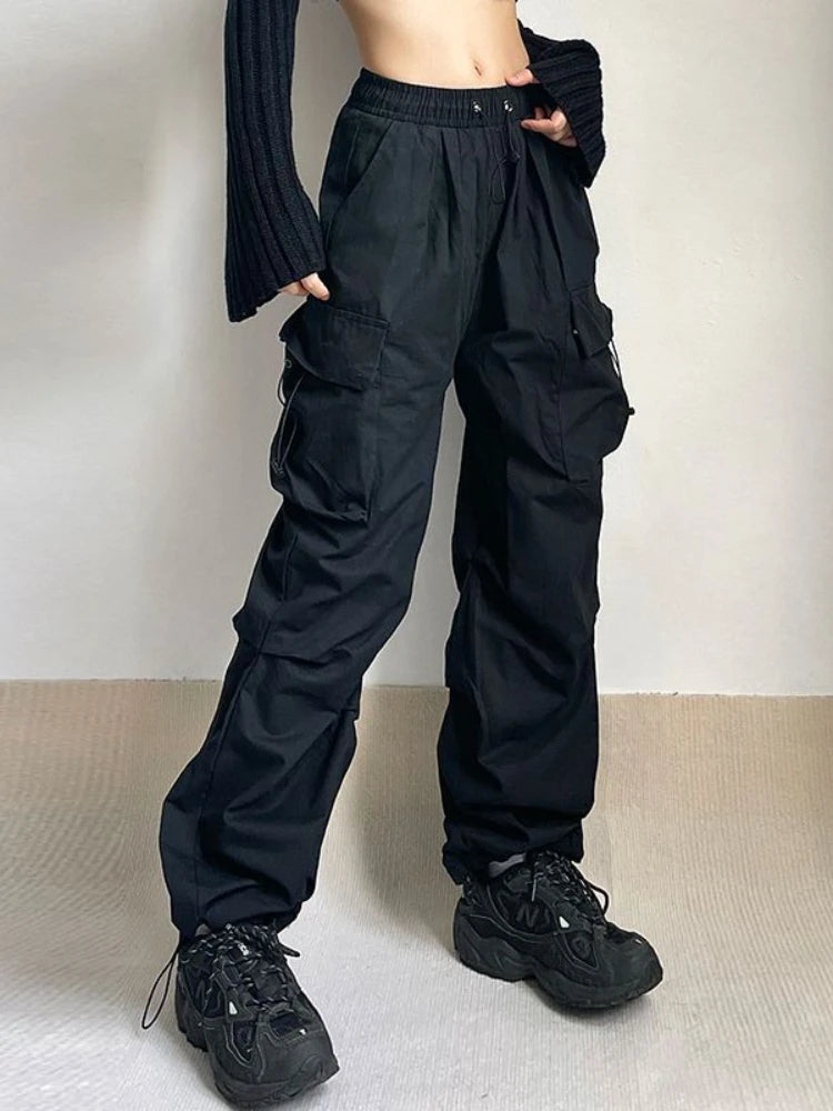 Black oversized wide-leg cargo pants with multi-pocket design and adjustable waist in breathable cotton blend