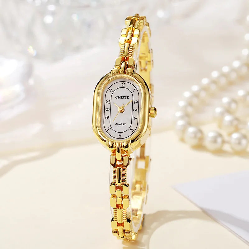 Empress oval quartz women's watch gold chain-link bracelet champagne dial crystal markers