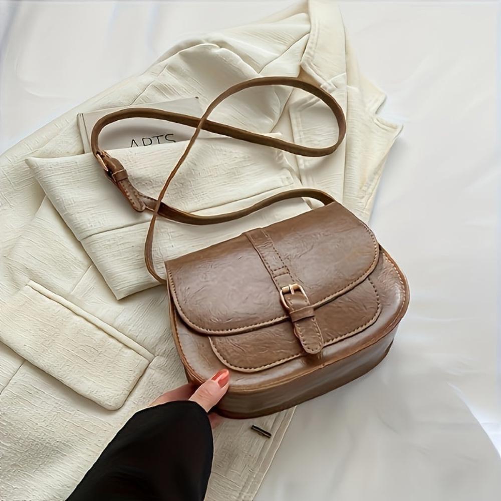 Michele small rectangular vegan leather crossbody bag with adjustable strap and buckle closure