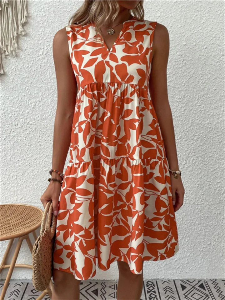 Floral printed tiered sleeveless dress with V-neckline and gathered waist in boho style