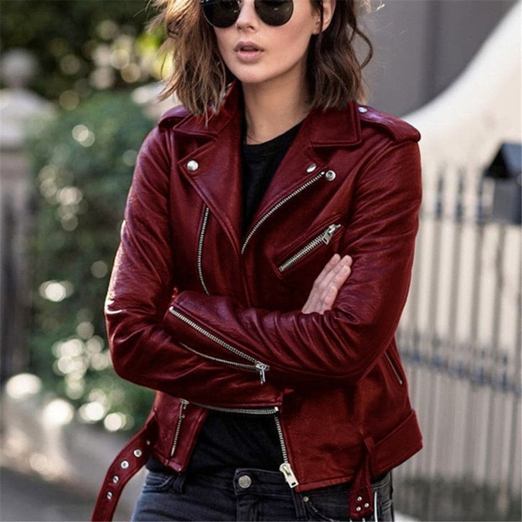Women's black biker jacket fitted silhouette with zip closures and classic moto style