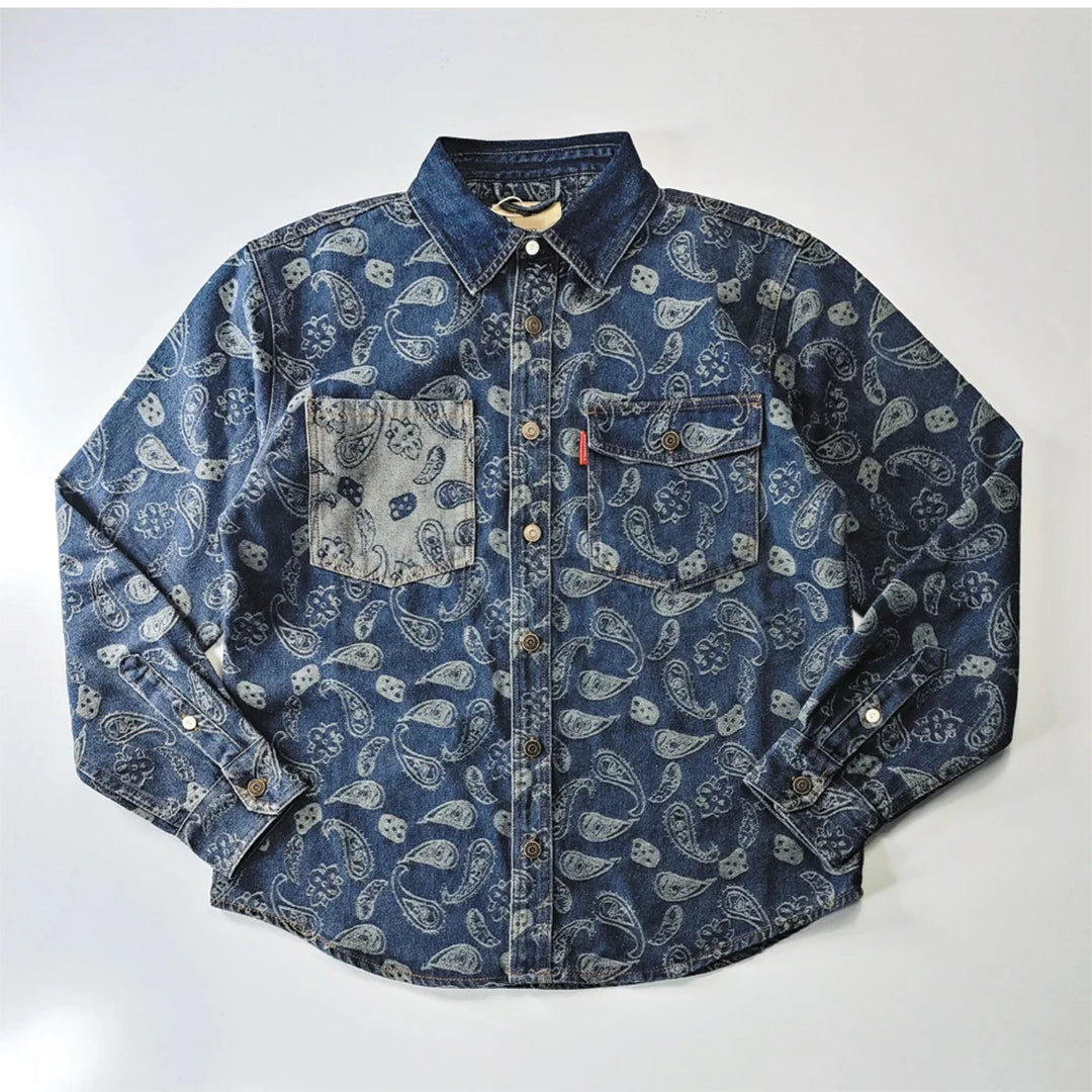Men's heavyweight cotton denim shirt with cashew print motif, contrast pocket, and faded blue finish