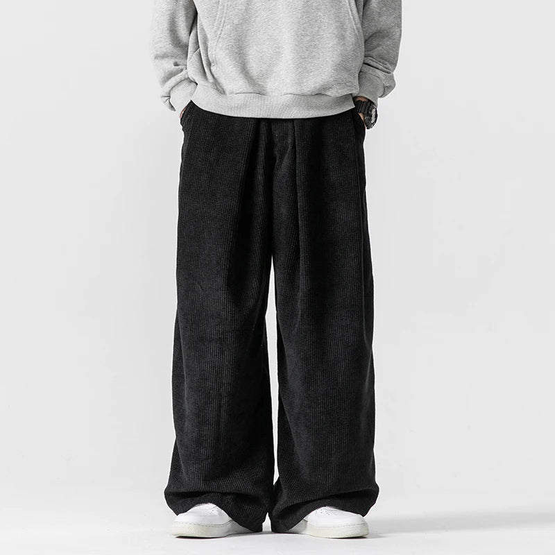 Women's brown corduroy wide-leg trousers with drawstring waist, relaxed 90s vintage silhouette