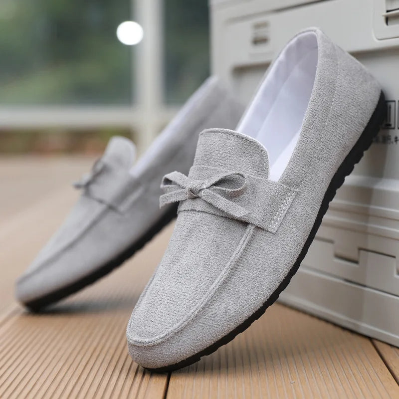 Women's suede bow loafers slip-on style in neutral tone with anti-slip rubber sole for all-day comfort
