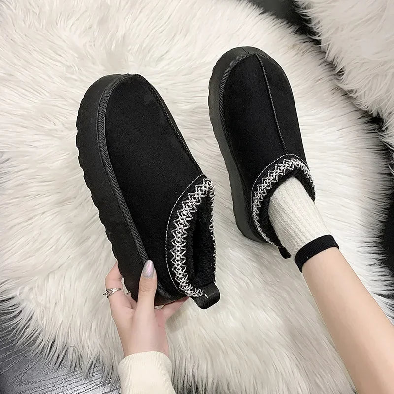Cozy alpine fleece slip-on mules with warm lined interior and durable traction sole