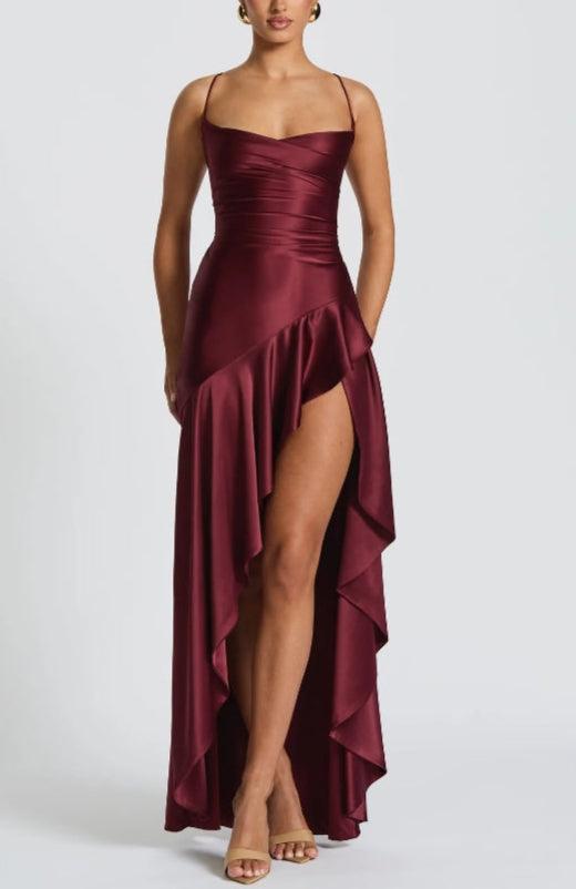 Navy satin halter maxi dress with ruffled skirt, open lace-up back, and twisted cowl neckline
