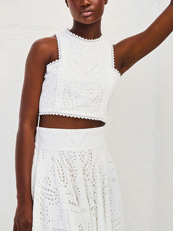 White sleeveless embroidered lace top with hollow cutout detailing, elegant feminine summer style