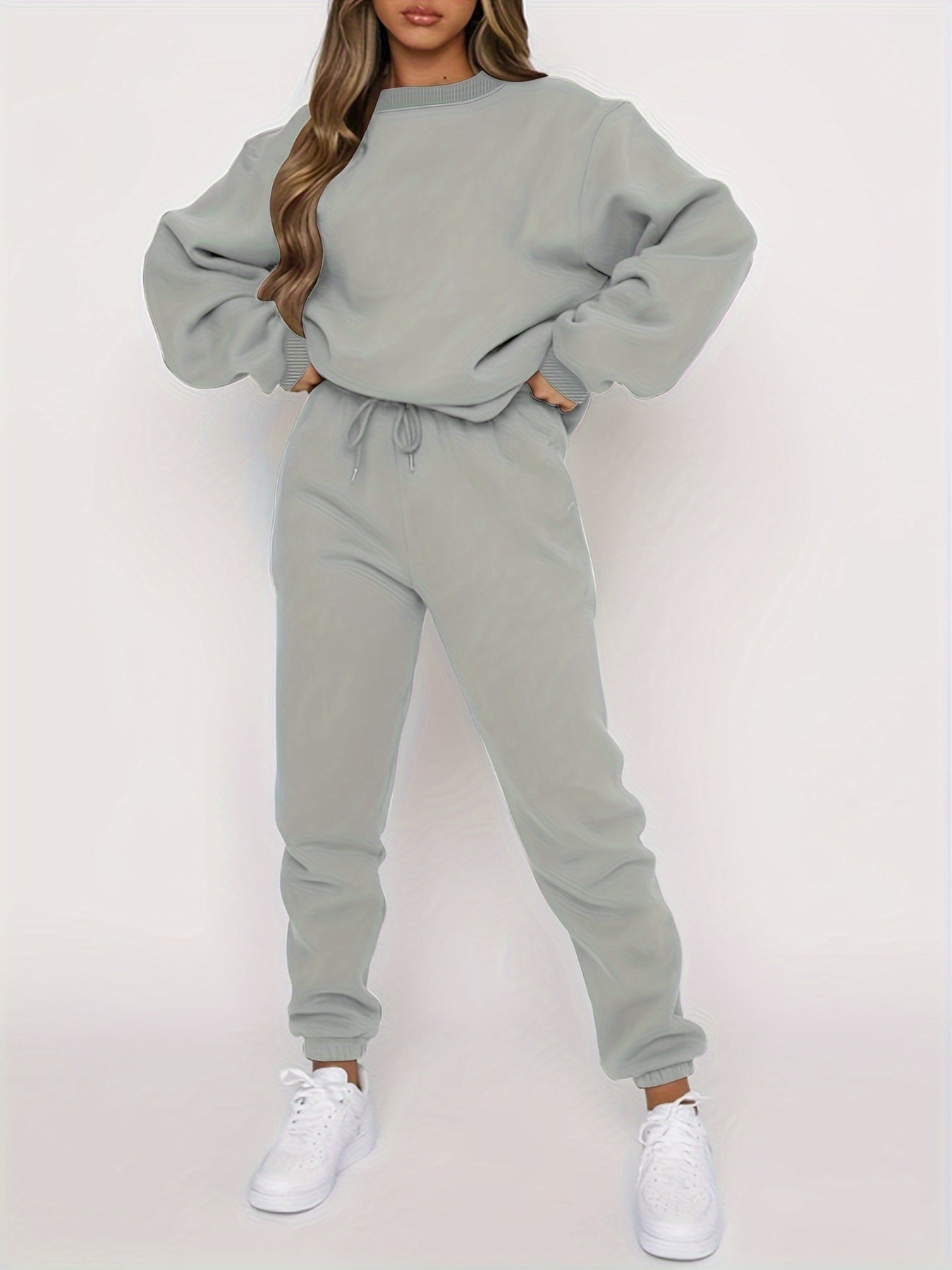 Women's cozy jogging set featuring oversized sweatshirt and high-waisted joggers for casual comfort