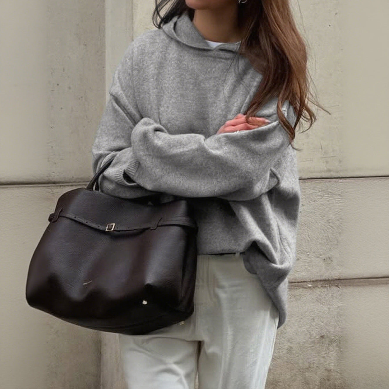 Women's oversized crew neck knit sweater in neutral tone, relaxed drapey silhouette for everyday comfort