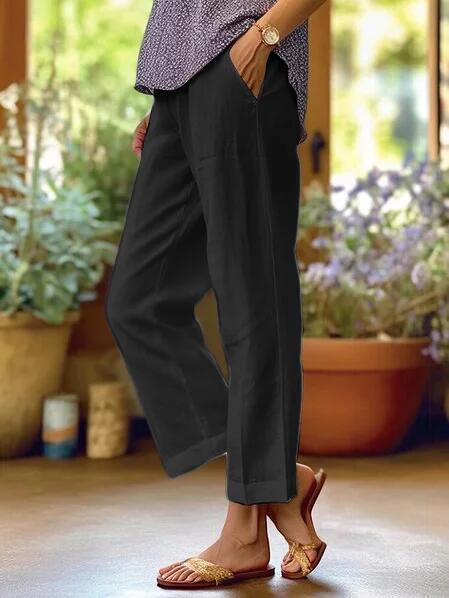 Relaxed ankle-length trousers in neutral tone, wide-leg casual cut with clean modern finish