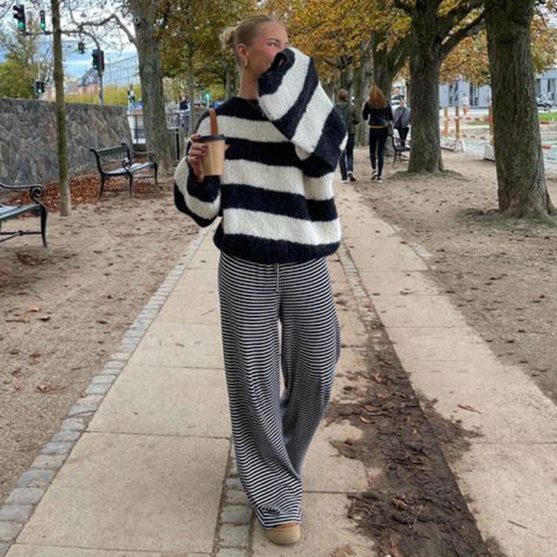 Women's relaxed striped pants in soft spring tones with a flowing silhouette for casual everyday style