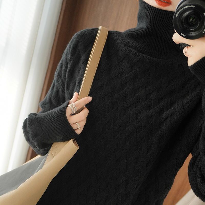 Women's cream cashmere turtleneck sweater with cable-knit texture and relaxed fit for cozy luxury