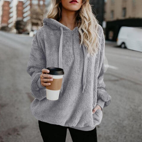 Unisex fleece hoodie in cozy fluffy fabric, relaxed fit casual streetwear style for cold days