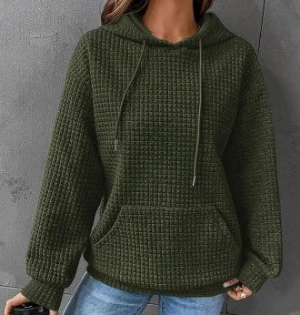 Women's loose fit hoodie with kangaroo pocket in soft textured fabric for casual everyday comfort