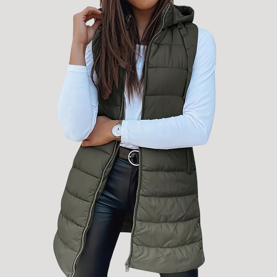 Women's lightweight hooded puffer vest in neutral tone, sleeveless quilted design for winter layering