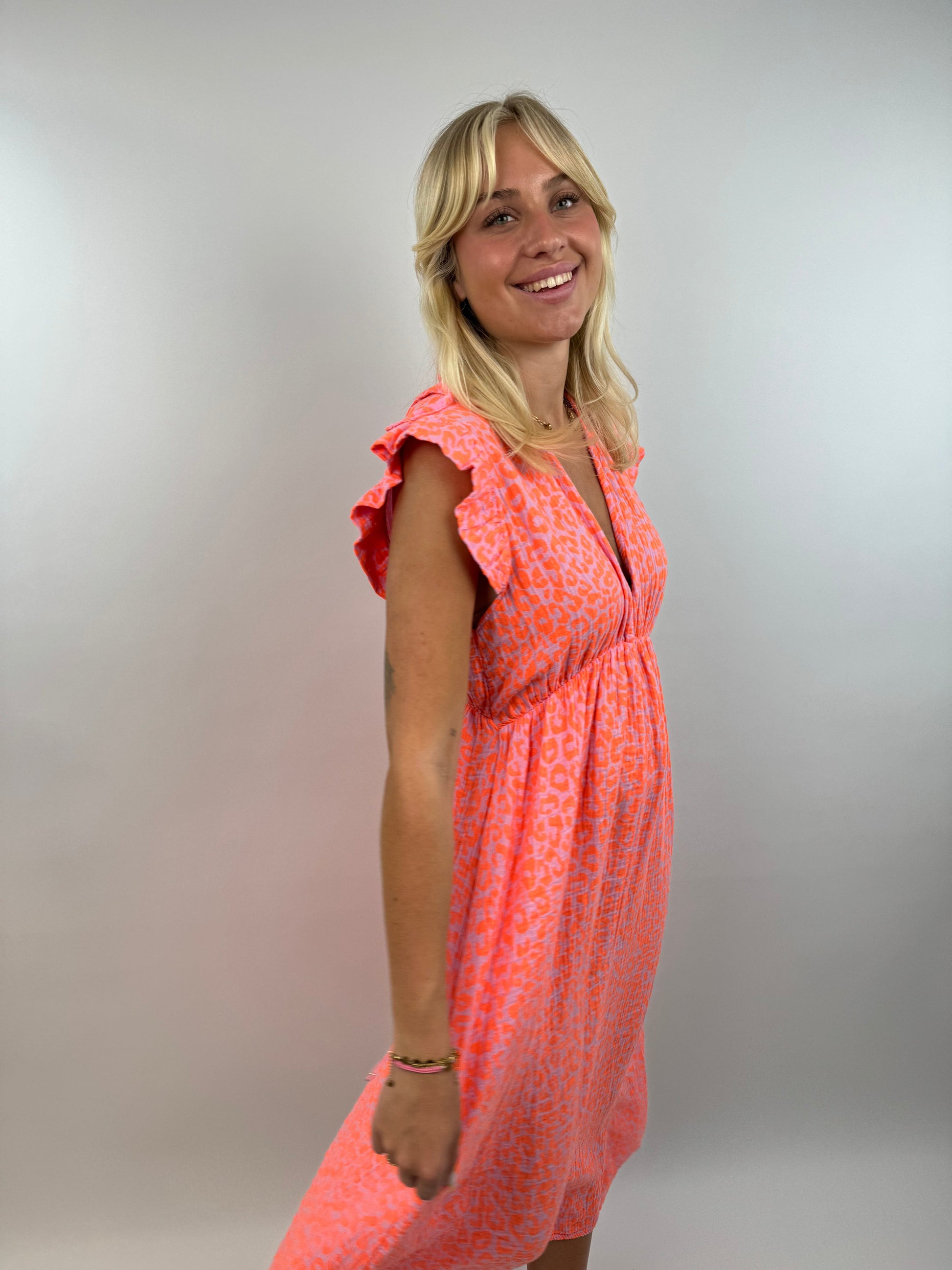 Women's neon muslin dress flowing silhouette with light ruffle sleeves bold summer style