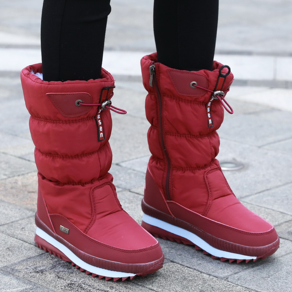 Women's insulated winter boots with zipper closure, sleek silhouette, cozy lining for outdoor cold weather