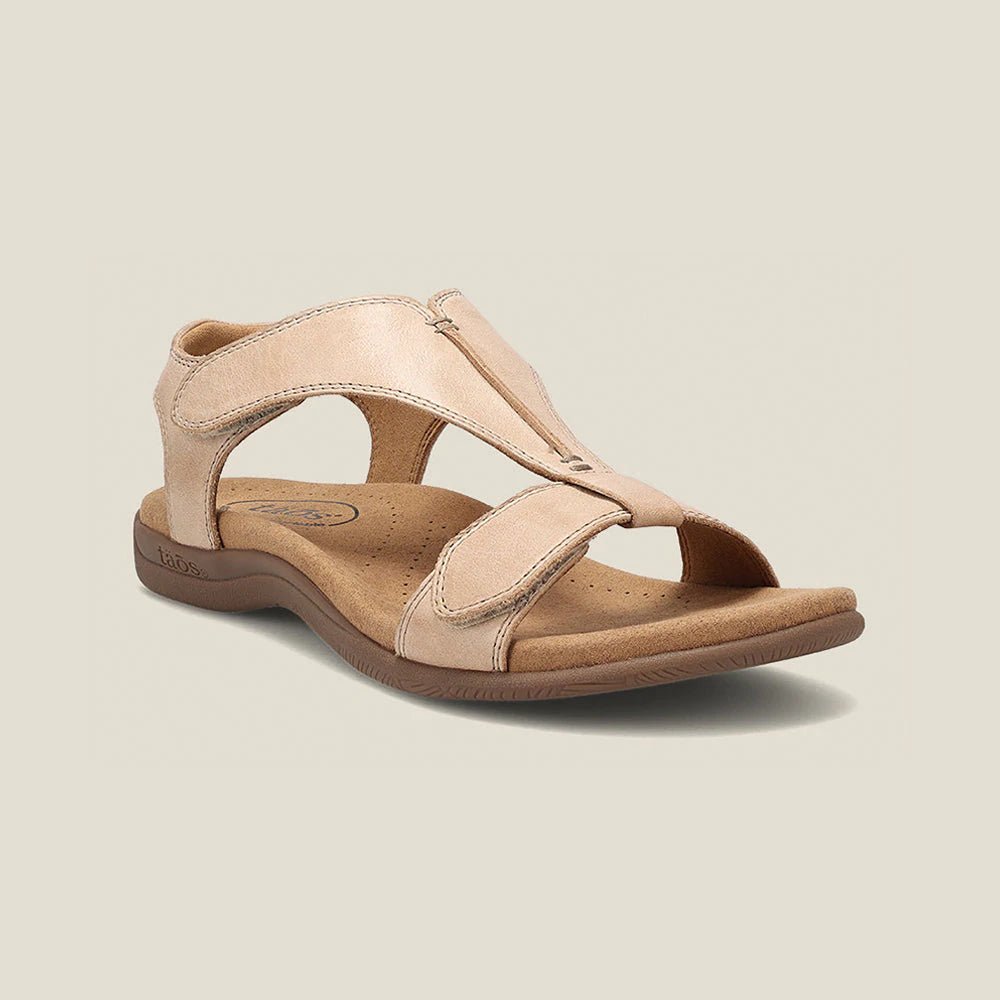 Beige adjustable strap sandals with contoured footbed, open-toe silhouette, lightweight travel-ready design