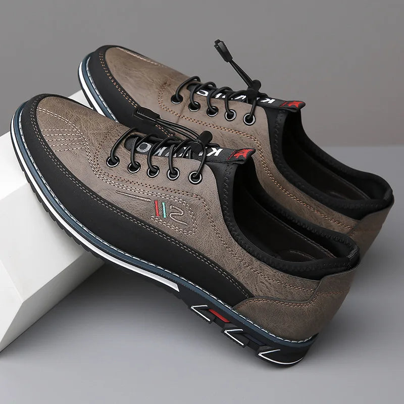 Men's low-profile PU leather sneaker with textile upper and structured outsole for everyday comfort