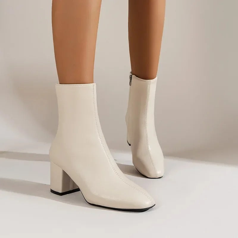 Women's elegant pointed-toe ankle boots with side zipper and cushioned mid heel in versatile style