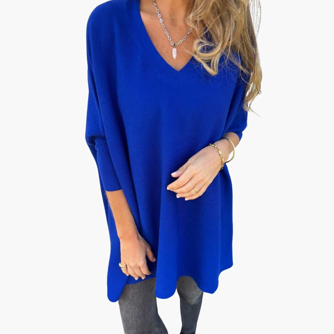 Women's loose-fit V-neck knit sweater in neutral tone, cozy everyday style with elegant neckline