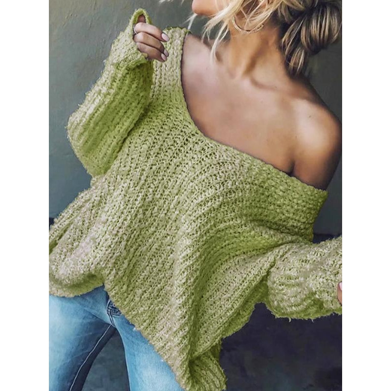 Women's relaxed drop-shoulder knit sweater in soft textured fabric with draped silhouette
