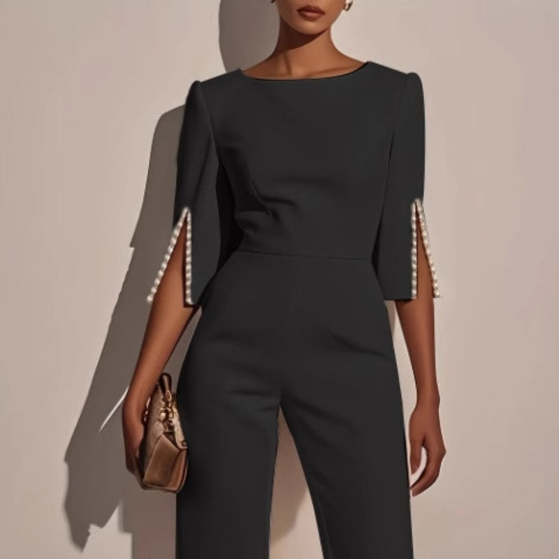 Ivory wide-leg jumpsuit with pearl embellishments, boat neckline, tailored fit, split sleeves