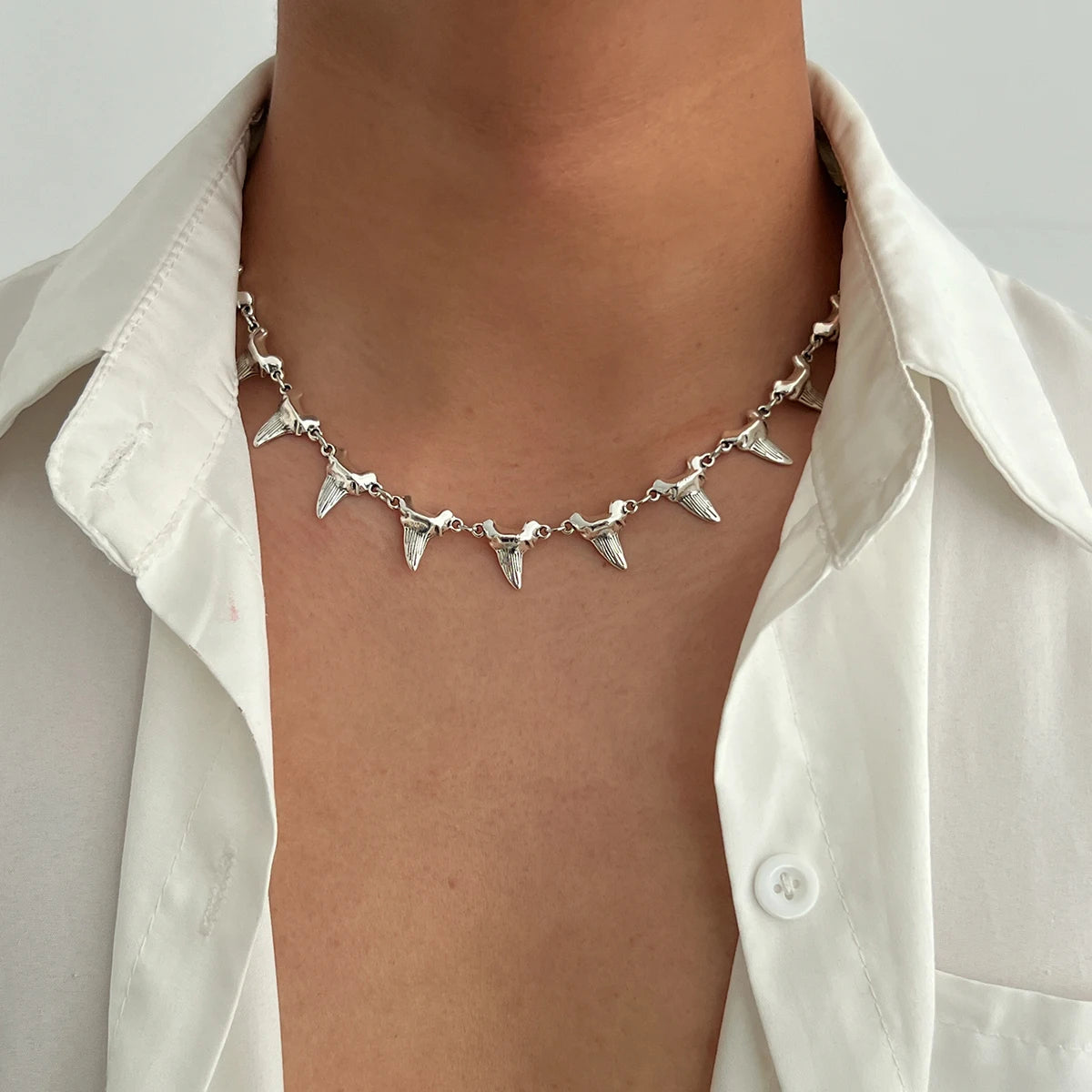 Bold sculptural fang spike necklace in gold or silver with adjustable chain for open shirt edgy style