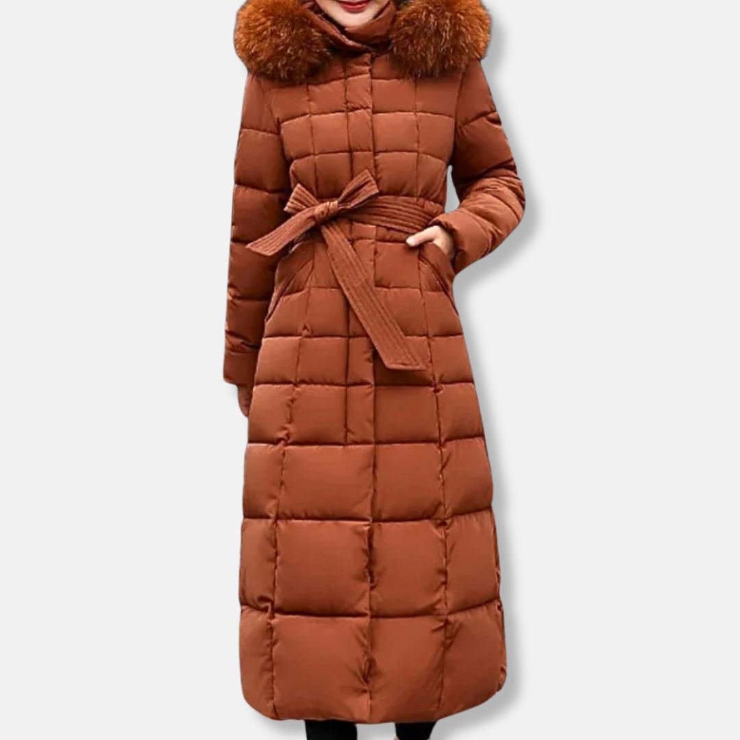 Women's long quilted slim-fit coat with belted waist and fur-trimmed hood for cold weather